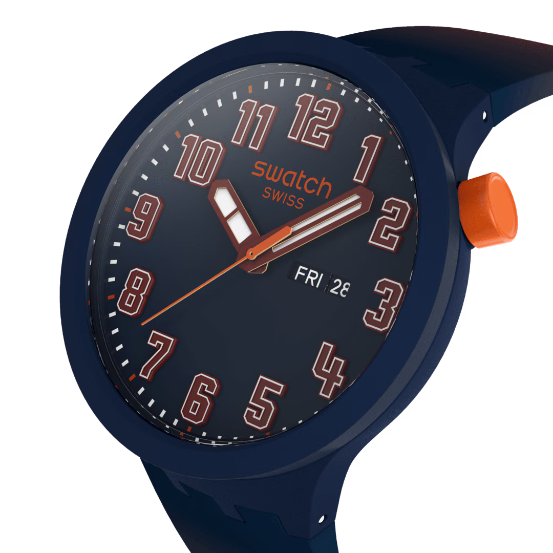 Close-up of Swatch watch dial with bold numerals, orange hands, and dark blue case