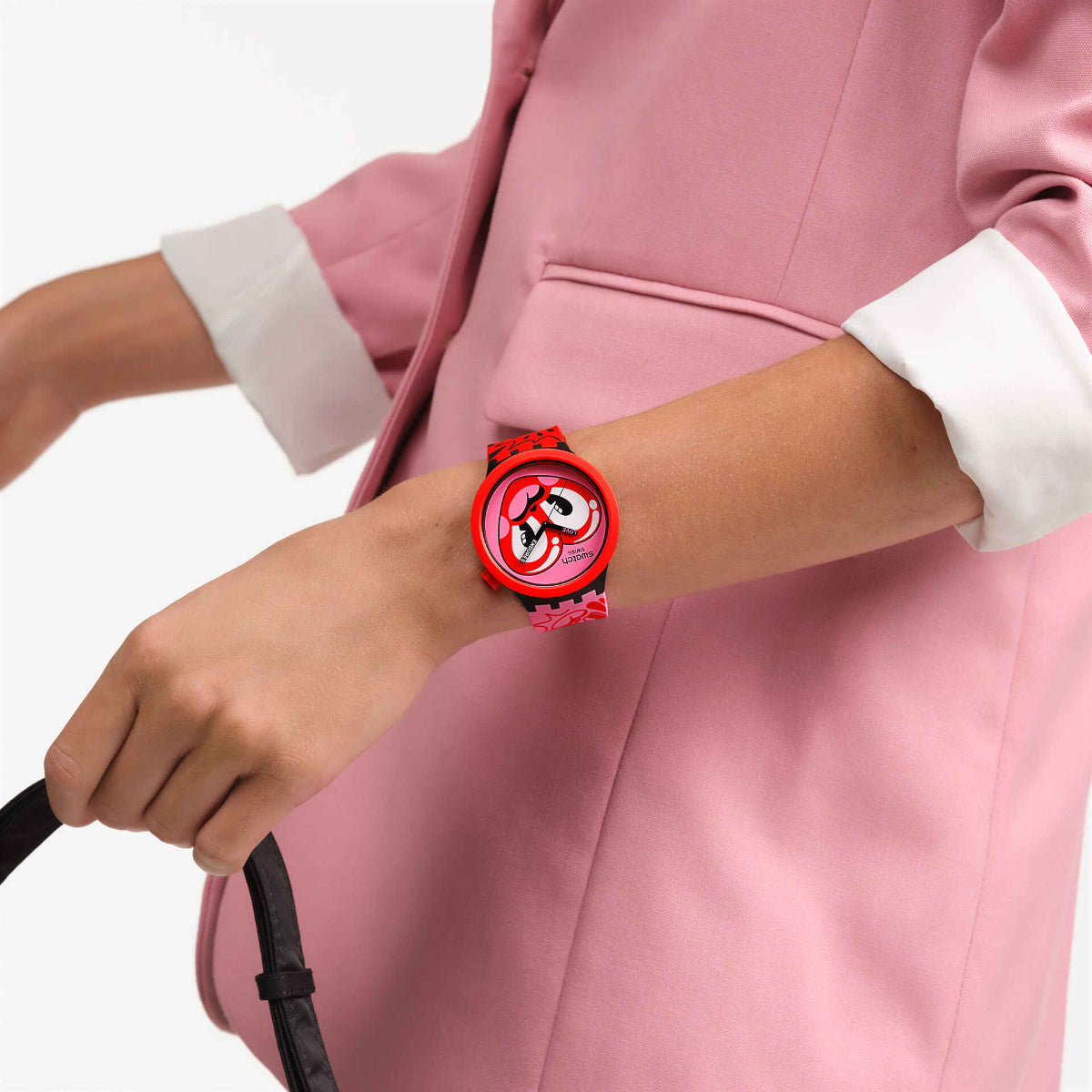 Red silicone strap heart-dial quartz watch worn on wrist
