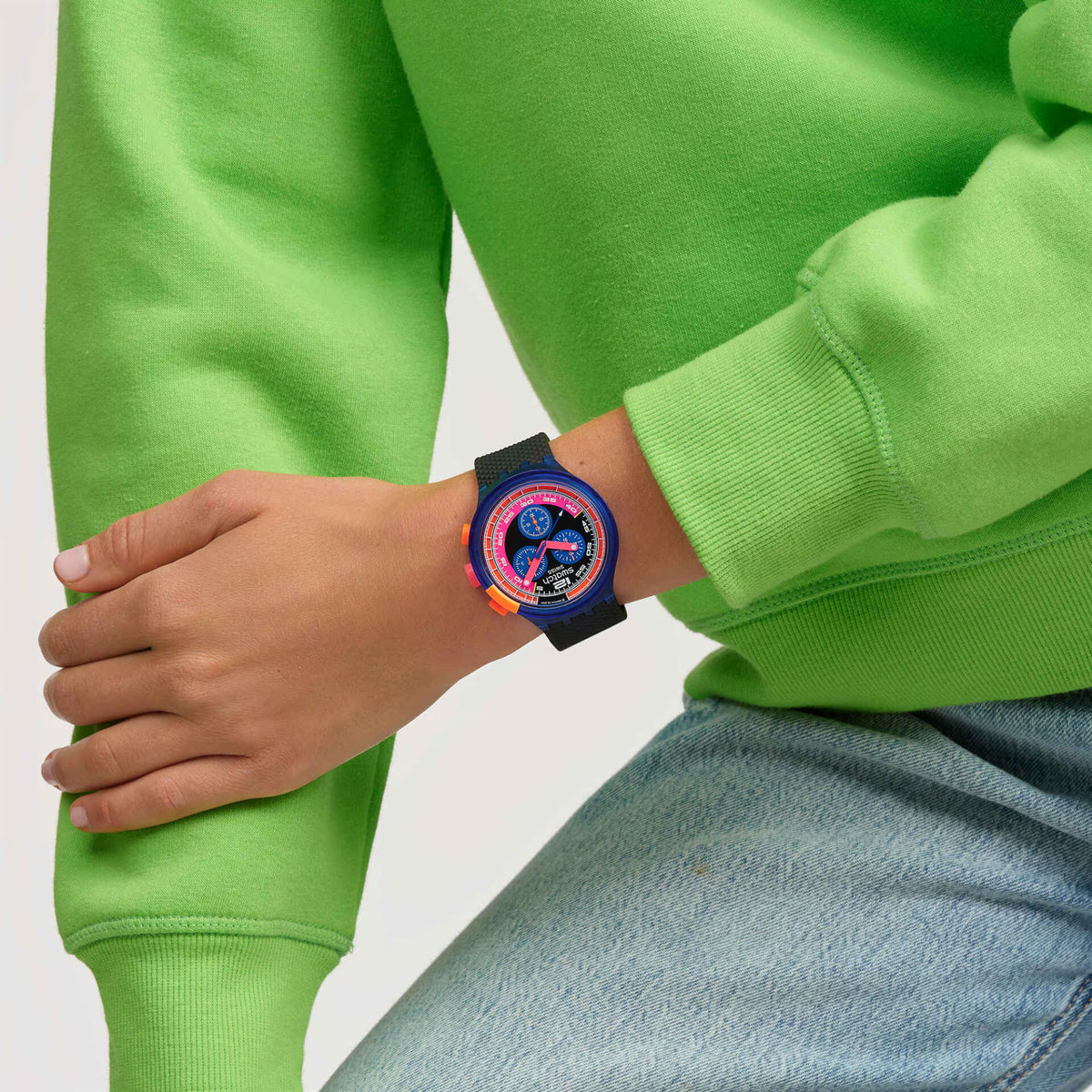 Men's sport watch with blue case, black textured strap, neon multicolor chronograph dial