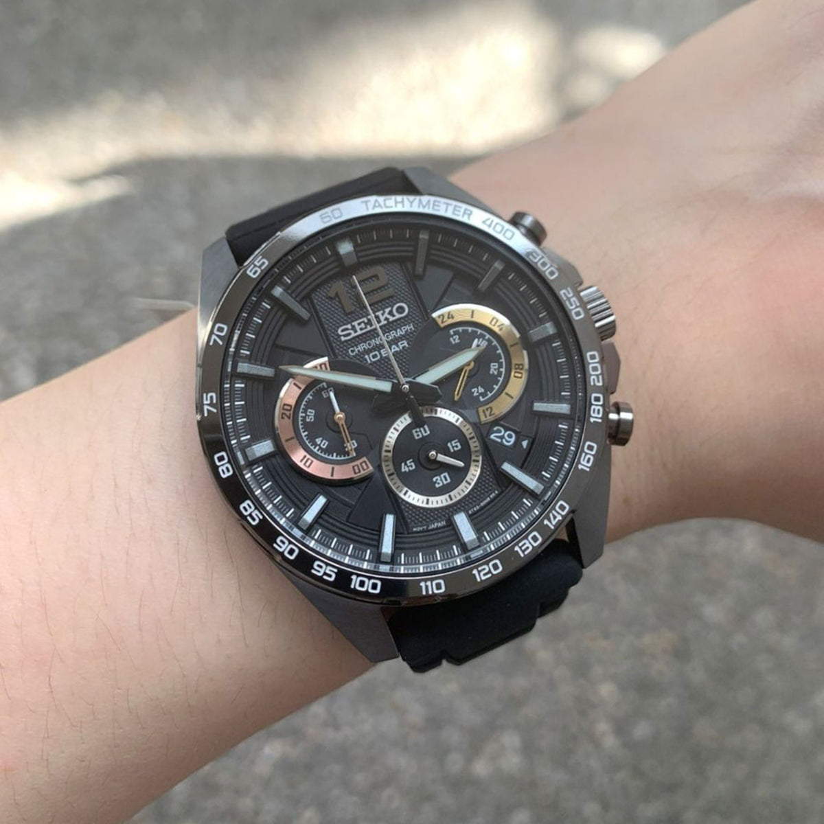 Seiko Essentials SSB349P1 black dial close up front view on wrist