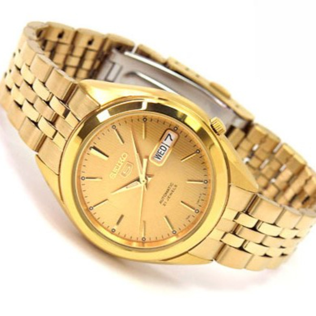 Gold-tone Seiko watch with champagne dial and linked metal bracelet, side angle view.