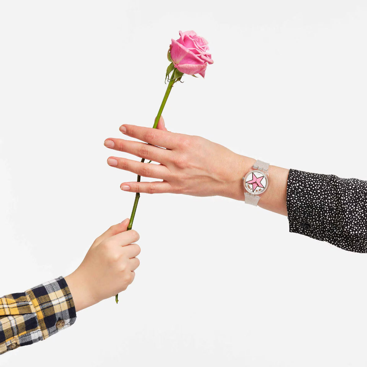 Ladies watch on wrist with pink star dial and speckled light strap