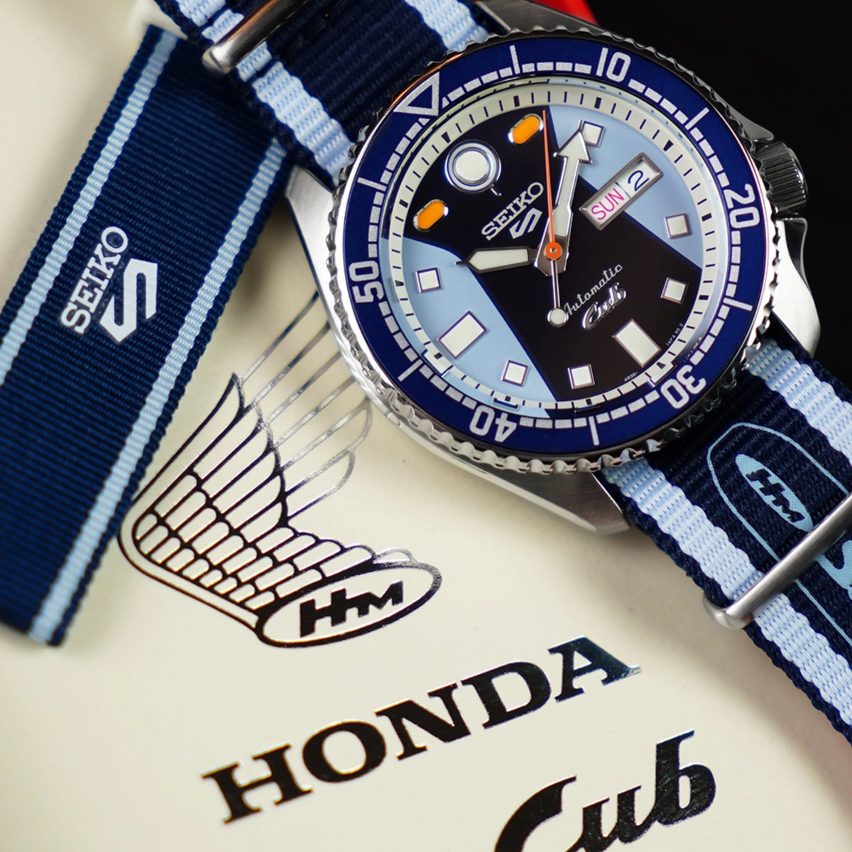 Blue dial automatic diver watch with blue-white NATO strap