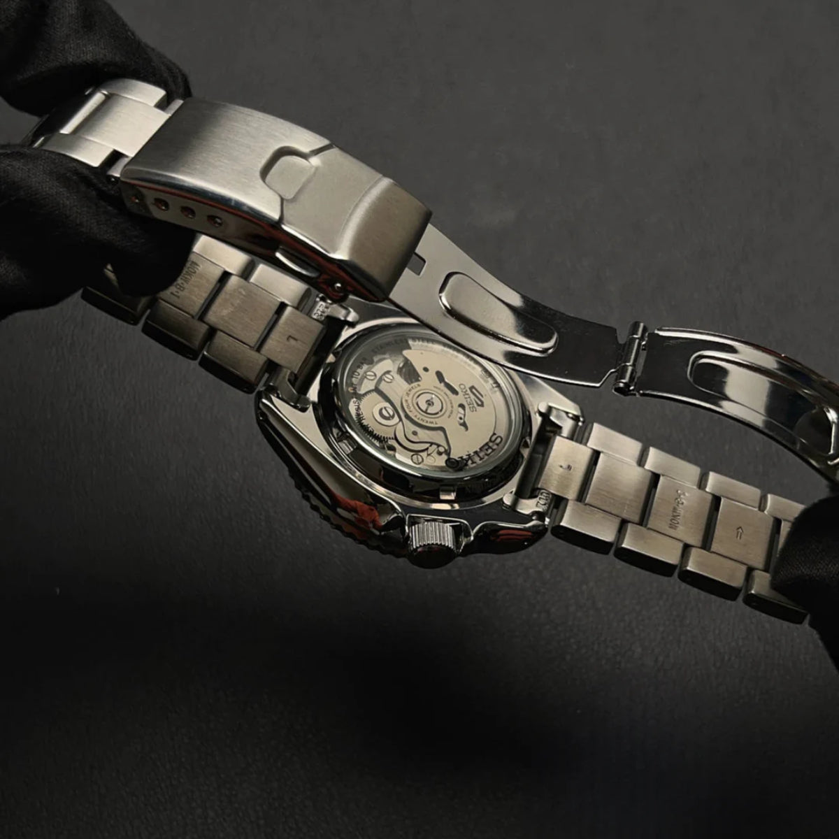 Seiko 5 Sports SRPK65K1 transparent exhibition caseback and automatic movement detail