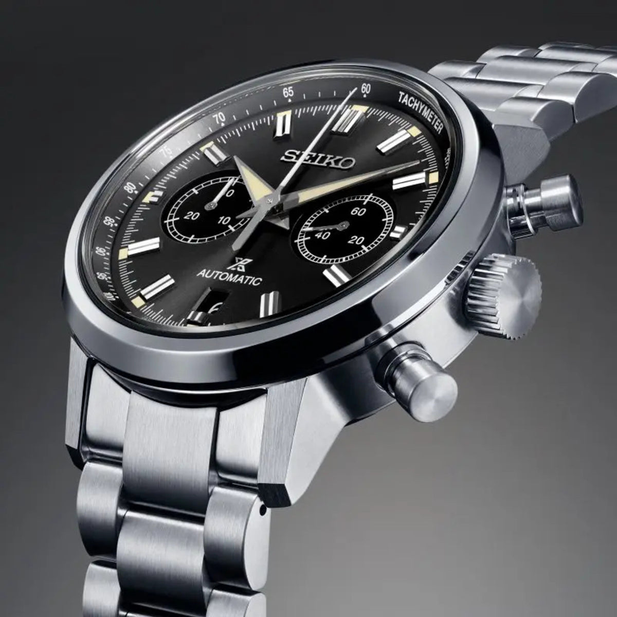 Stainless steel automatic chronograph watch with black dial, tachymeter, and crown details
