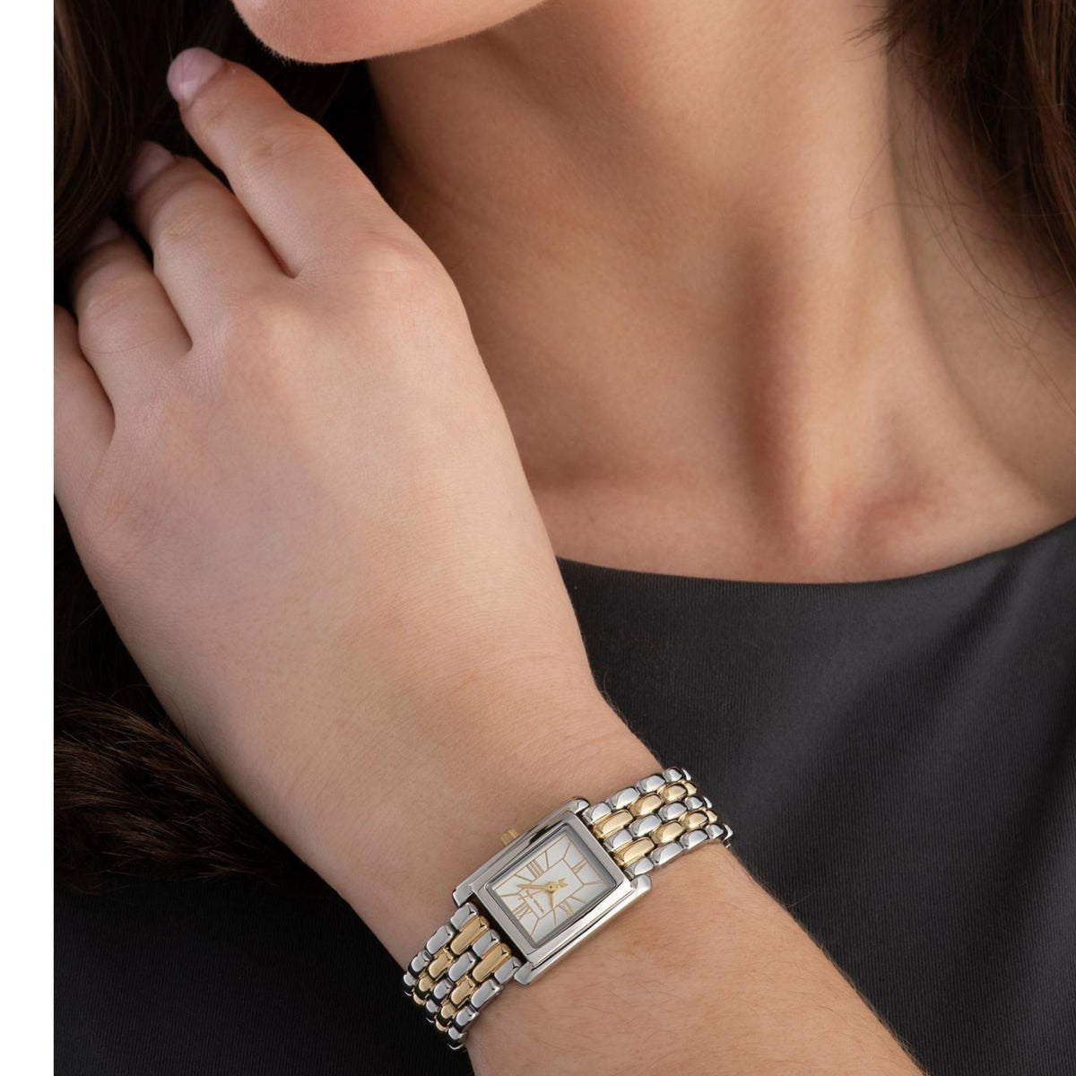 Michael Kors Petite MK4999 ladies quartz watch worn on a wrist showing the white dial, rectangular case, and two-tone bracelet