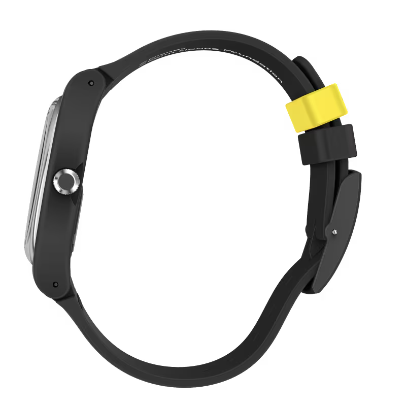 Black silicone quartz watch with side crown, round case, and yellow strap tag