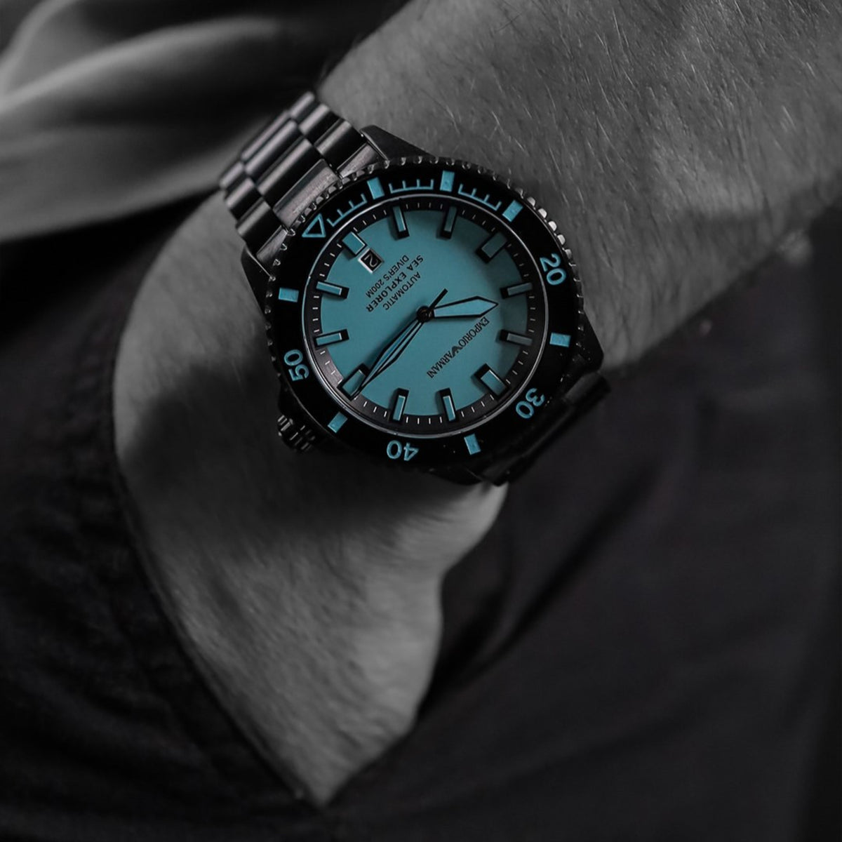 Emporio Armani Sea Explorer AR60084 timepiece with a light blue dial shown on a wrist