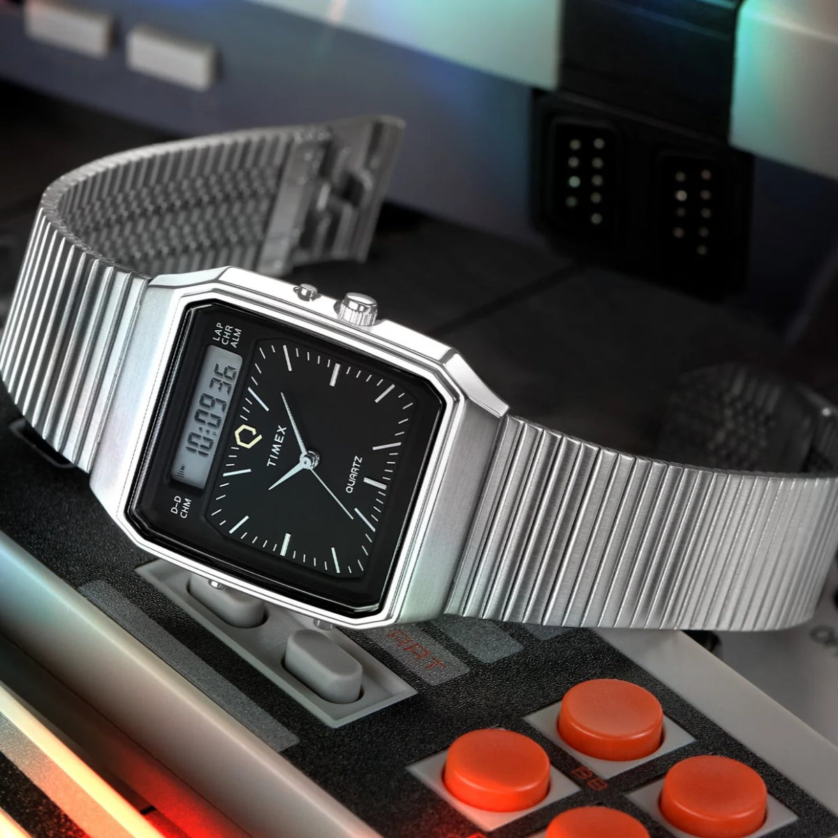 Black dial stainless steel Timex watch with rectangular bezel and ribbed metal bracelet