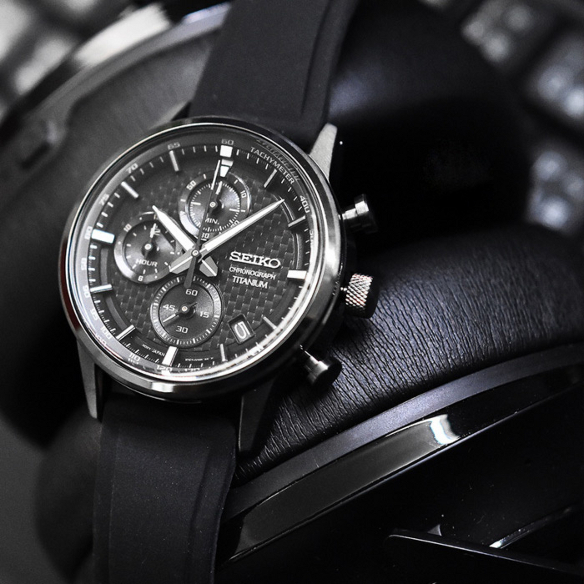 Seiko Essentials SSB393P1 mens watch resting on a dark textured background