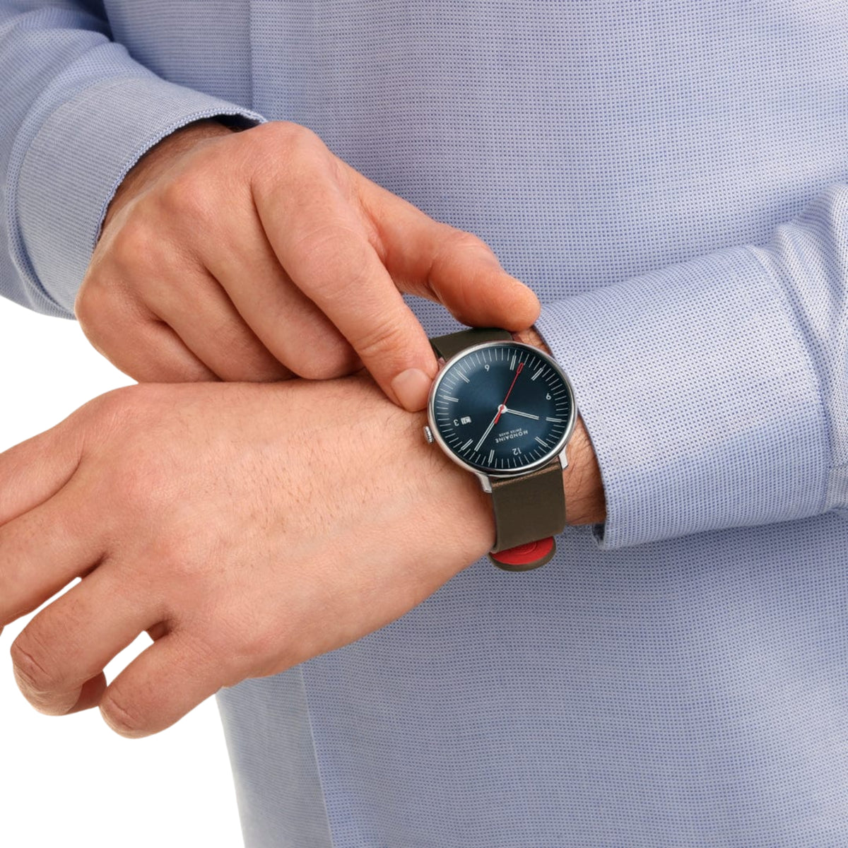 Men's Mondaine quartz watch with blue dial and brown leather strap, steel case