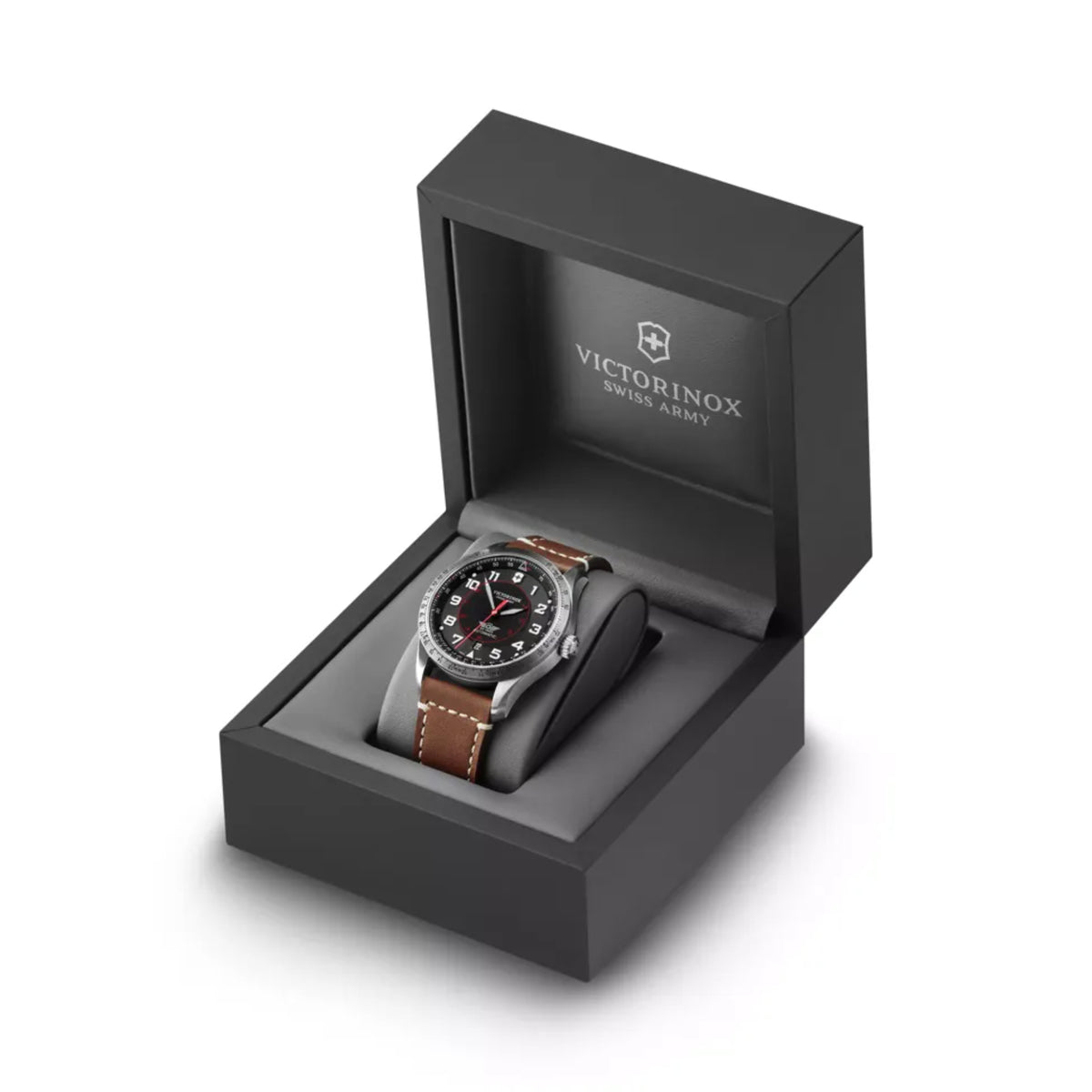 Men’s automatic watch resting in black gift box with brown leather strap.