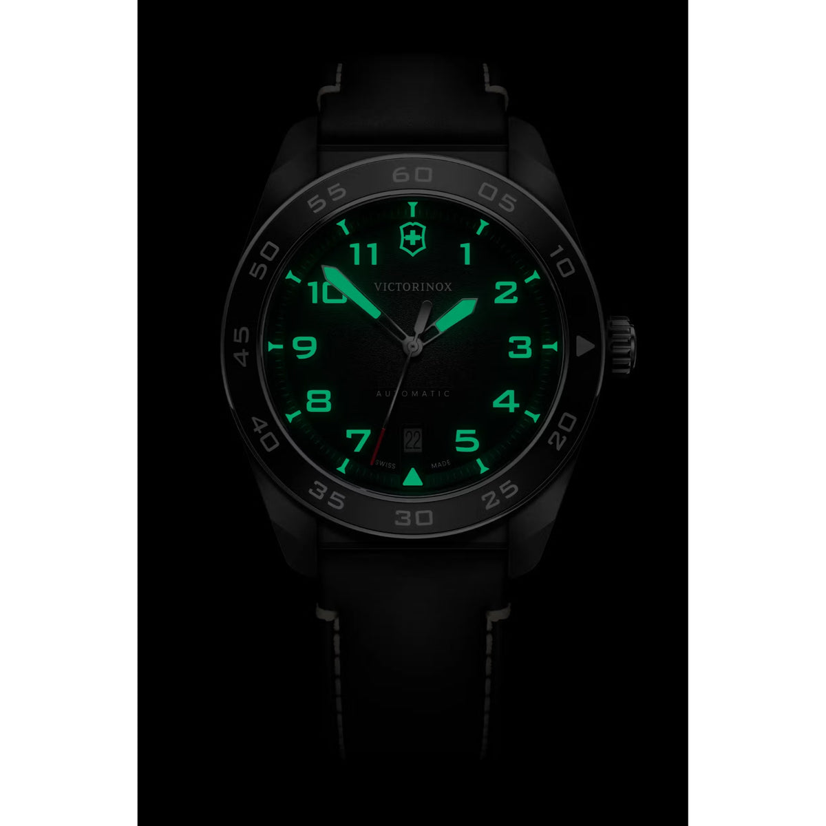 Victorinox Swiss Army automatic watch with black dial and green luminous hands, date window