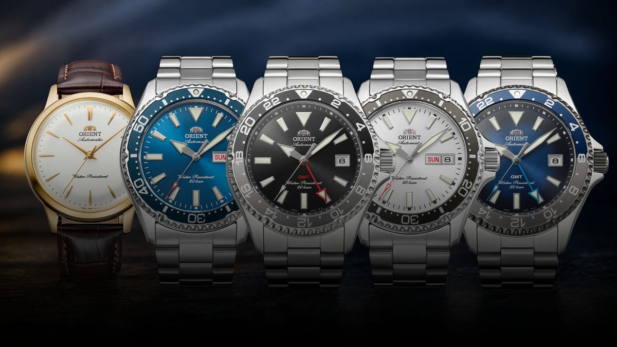 Orient watches for men lineup featuring stainless steel dive timepieces and a classic leather strap model on a dark backdrop