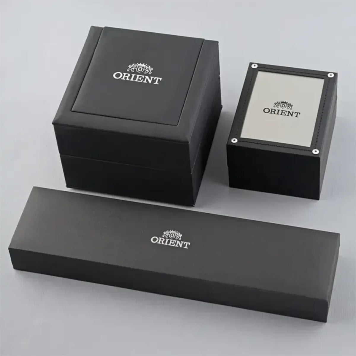 Orient watch presentation boxes with logos and tray, in black packaging