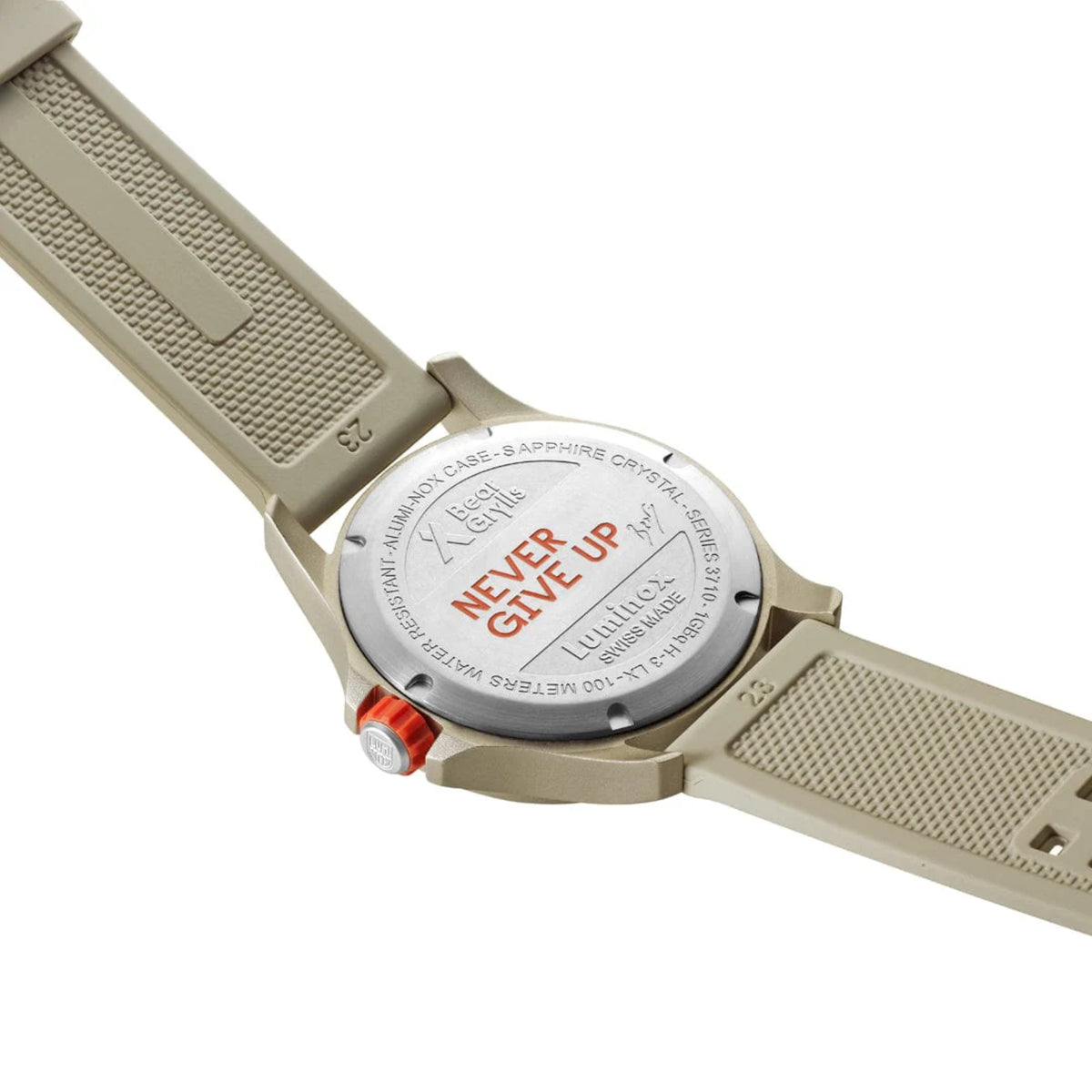 Stainless steel case back of the Luminox Bear Grylls Survival XB.3717 engraved with 'Never Give Up' and connected to a beige rubber strap