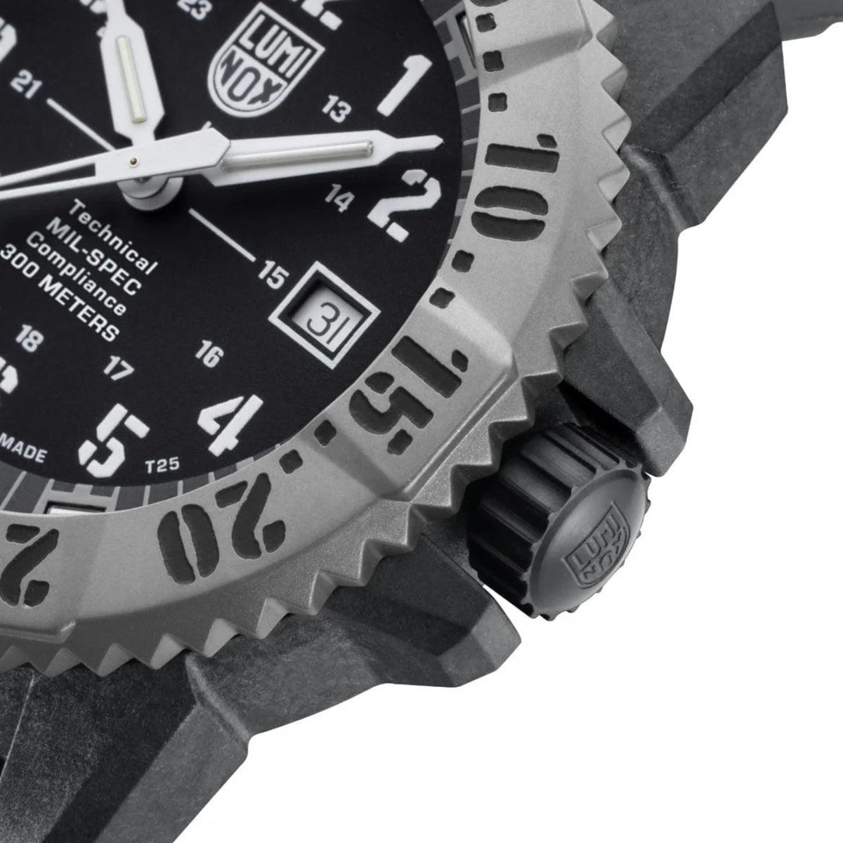 Close-up of rugged watch bezel with black dial markings and crown-side texture