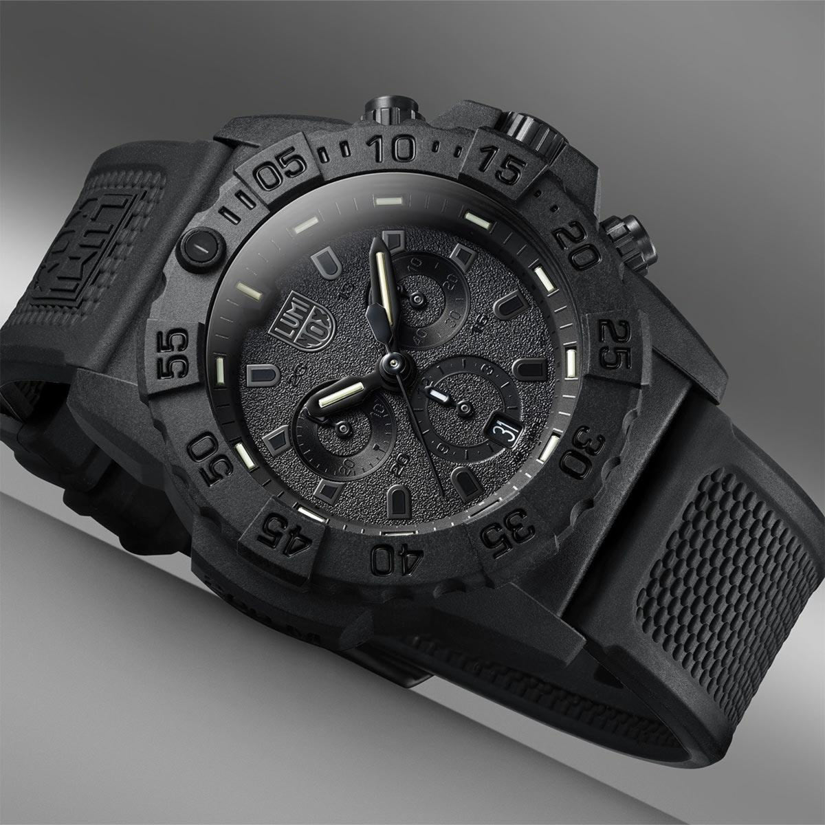 Close-up studio shot highlighting the monochromatic black face texture and bezel markings of the Luminox Navy SEAL XS.3581.BO