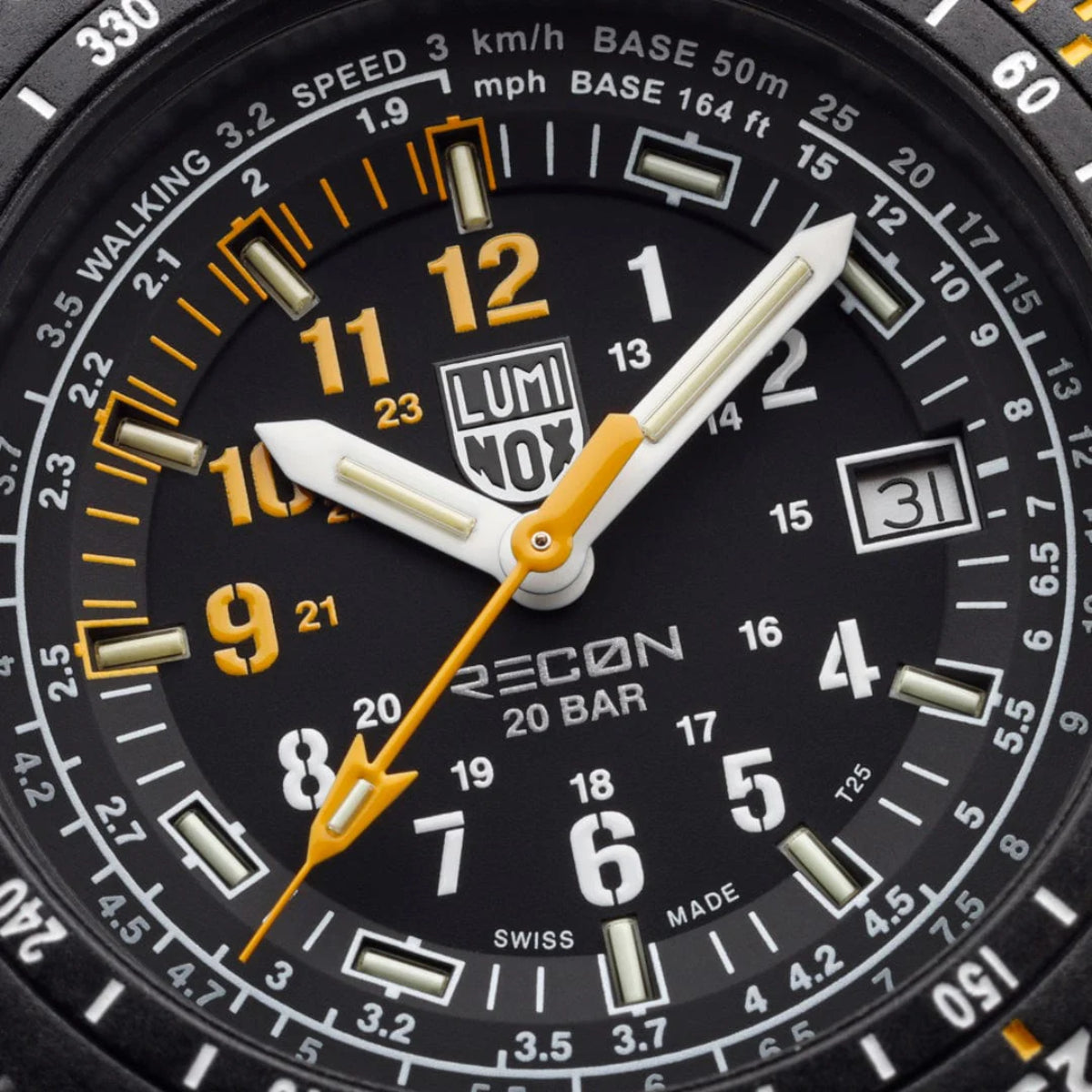 Luminox Recon watch dial close-up with gold hands, date window, and “ECO” text