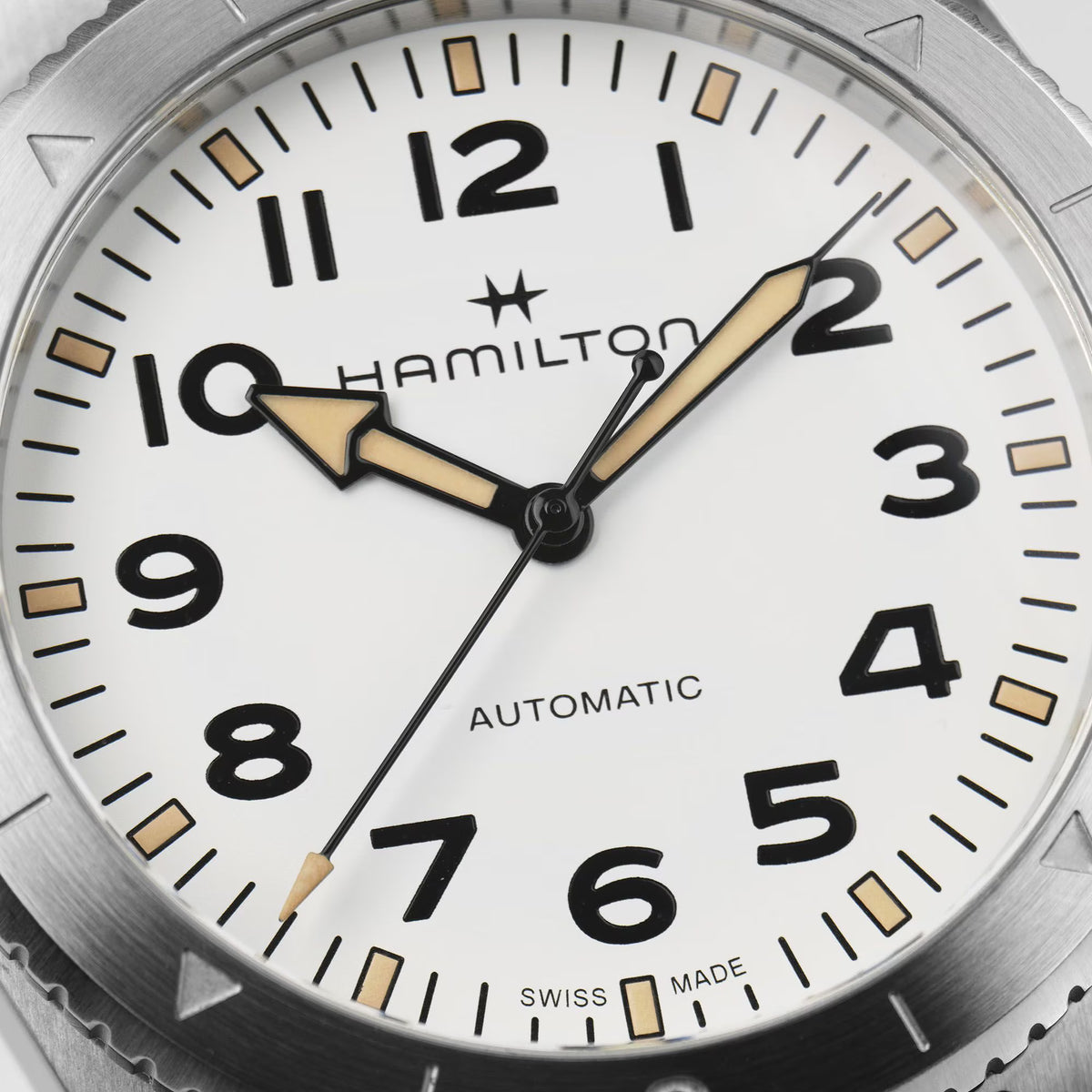 Hamilton Khaki Field Expedition H70315110 close-up view of white dial with automatic movement hands and hour markers