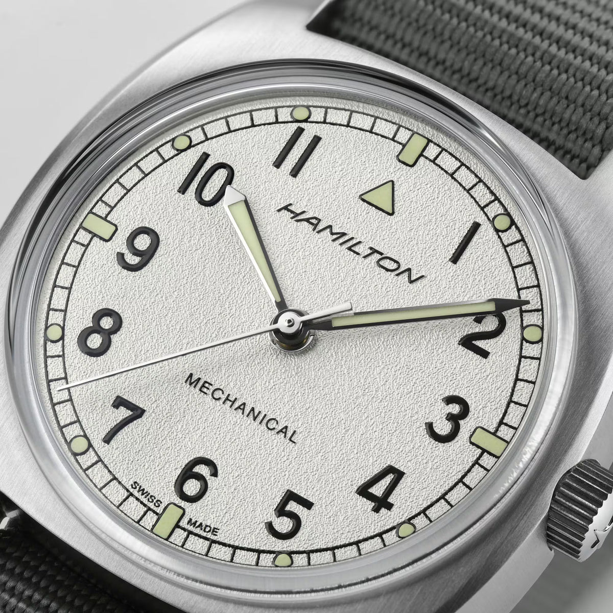 Hamilton H76419951 silver textured dial with bold Arabic numerals and sword hands close-up 