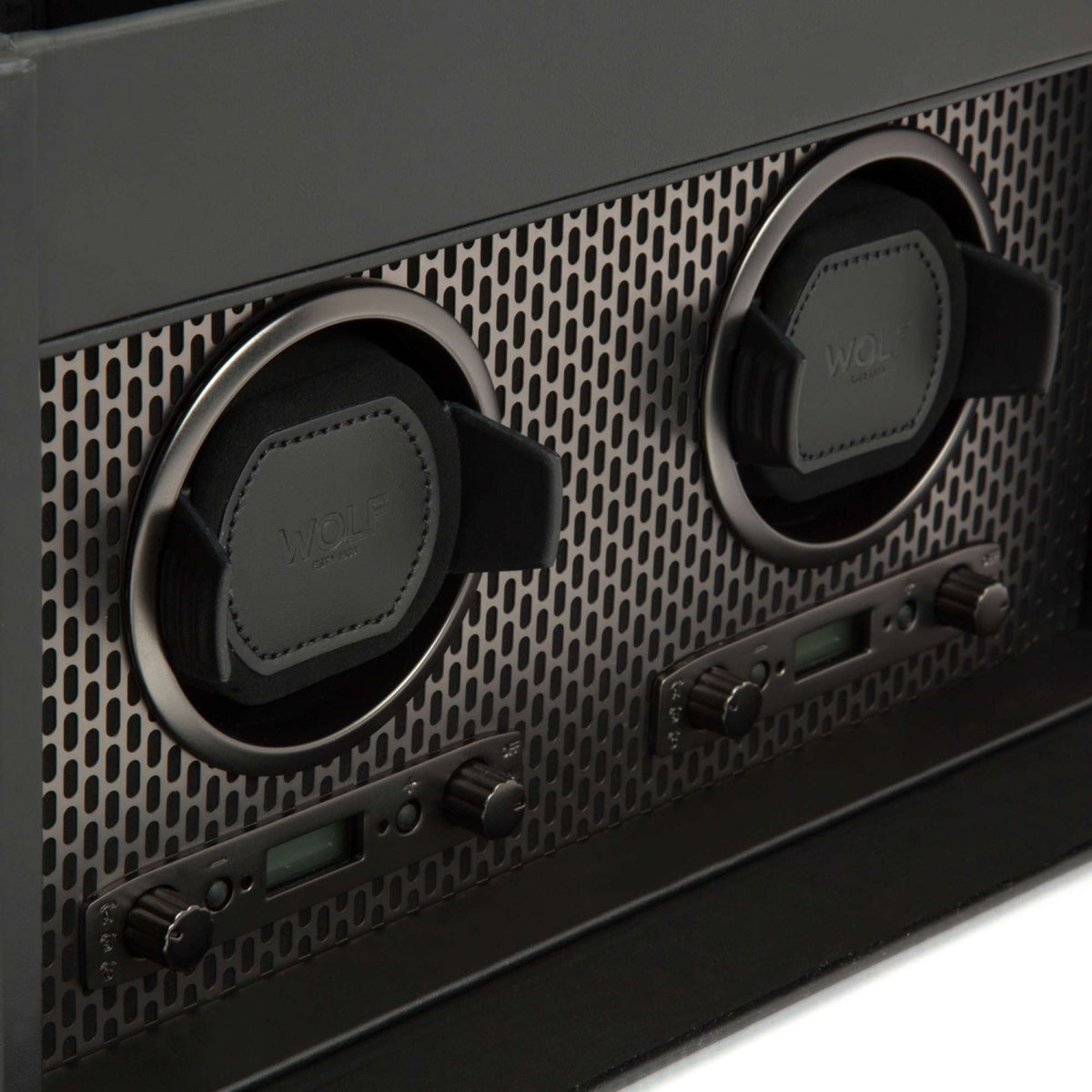 Black double watch winder detail: two round pads, winding controls and small display