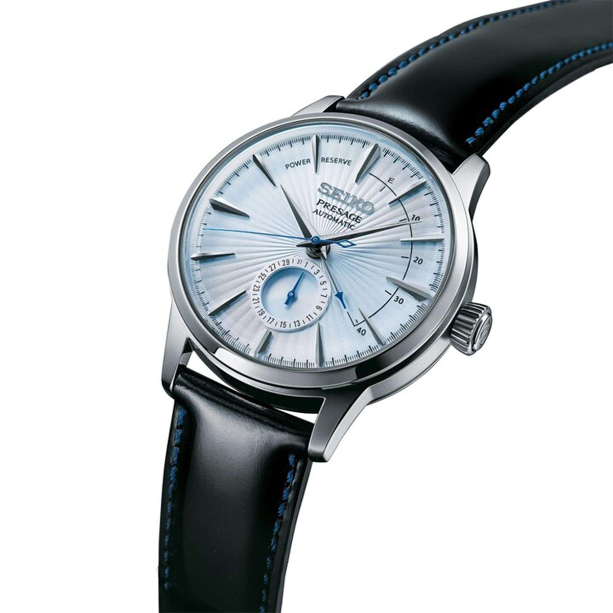 Men's automatic watch angled view, silver dial with blue hands, black leather strap