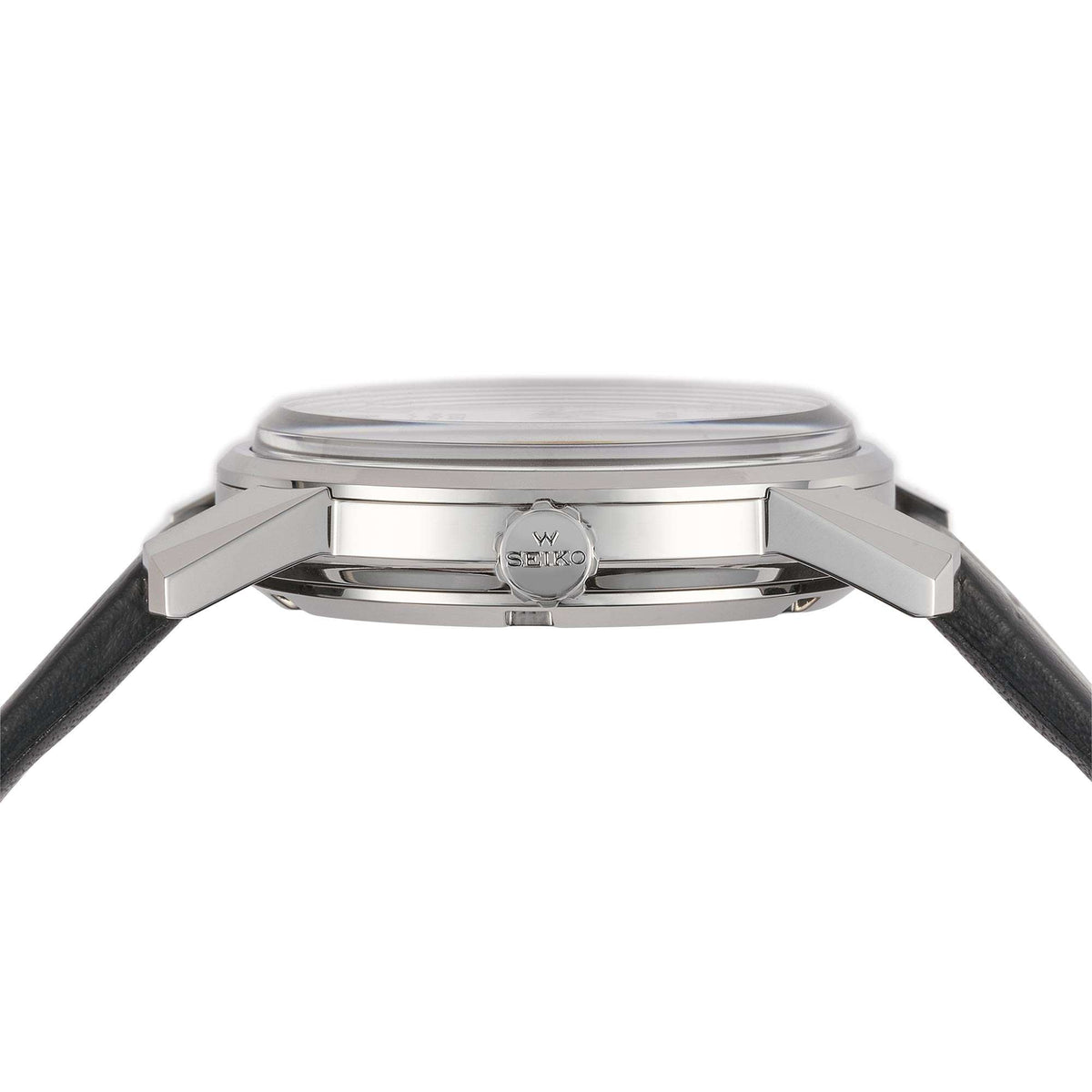 Automatic watch caseback with polished silver finish and black leather strap attached.