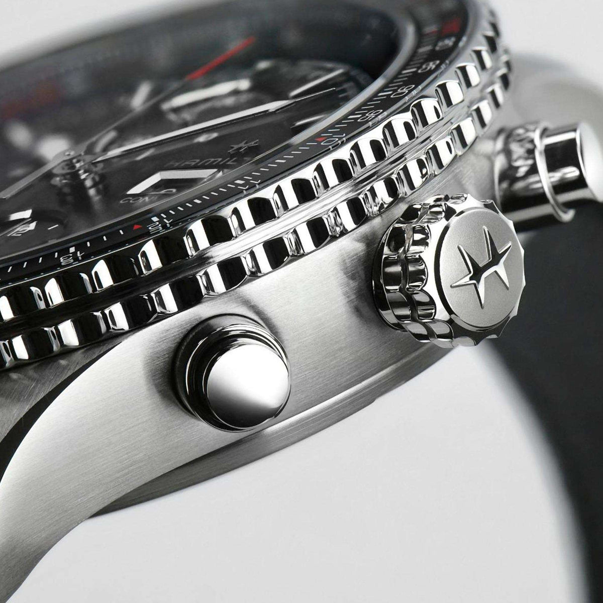 Stainless chronograph watch case with crown and textured bezel detail
