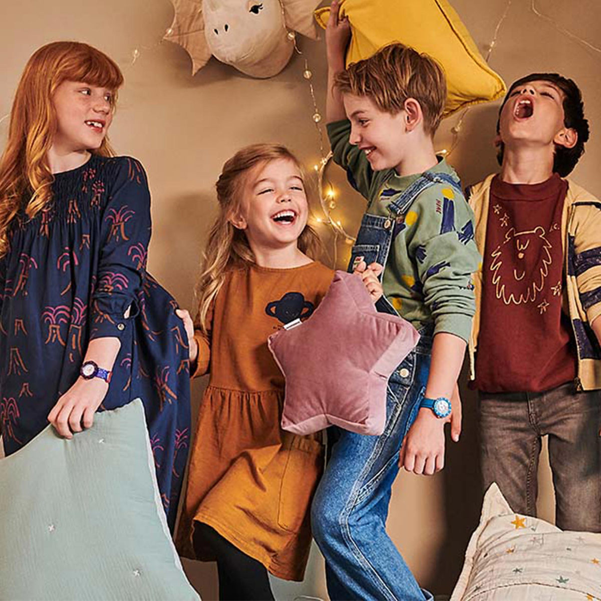 Kids playing while wearing blue textile-strap quartz watches with round blue dials
