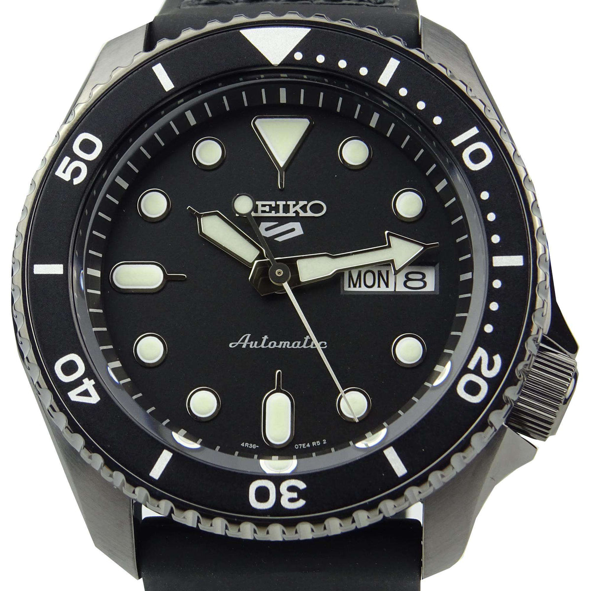 Men's automatic watch with black dial, black leather strap, and date window (MON 8).
