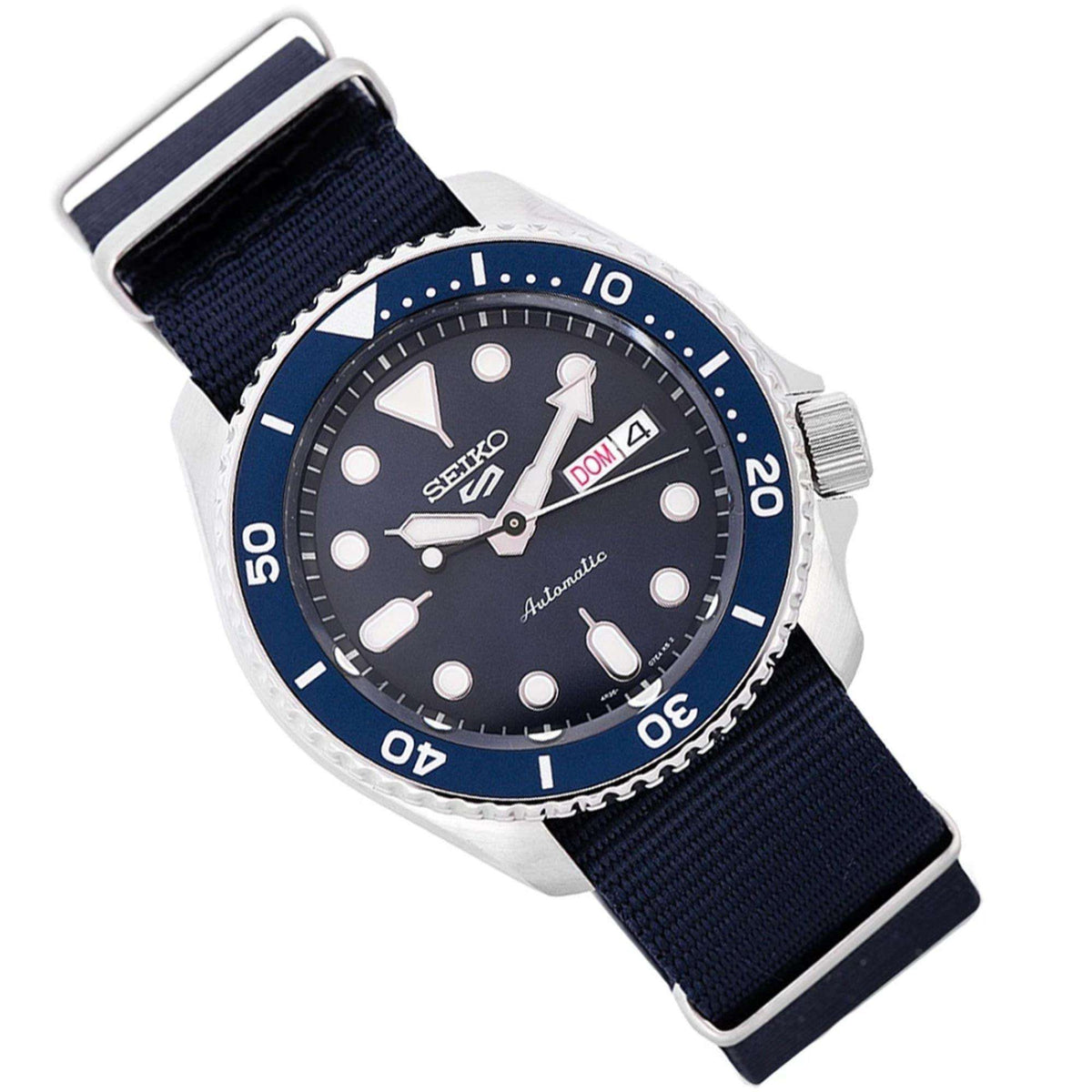Men's automatic diver watch, angled view: blue dial with date window and navy canvas strap