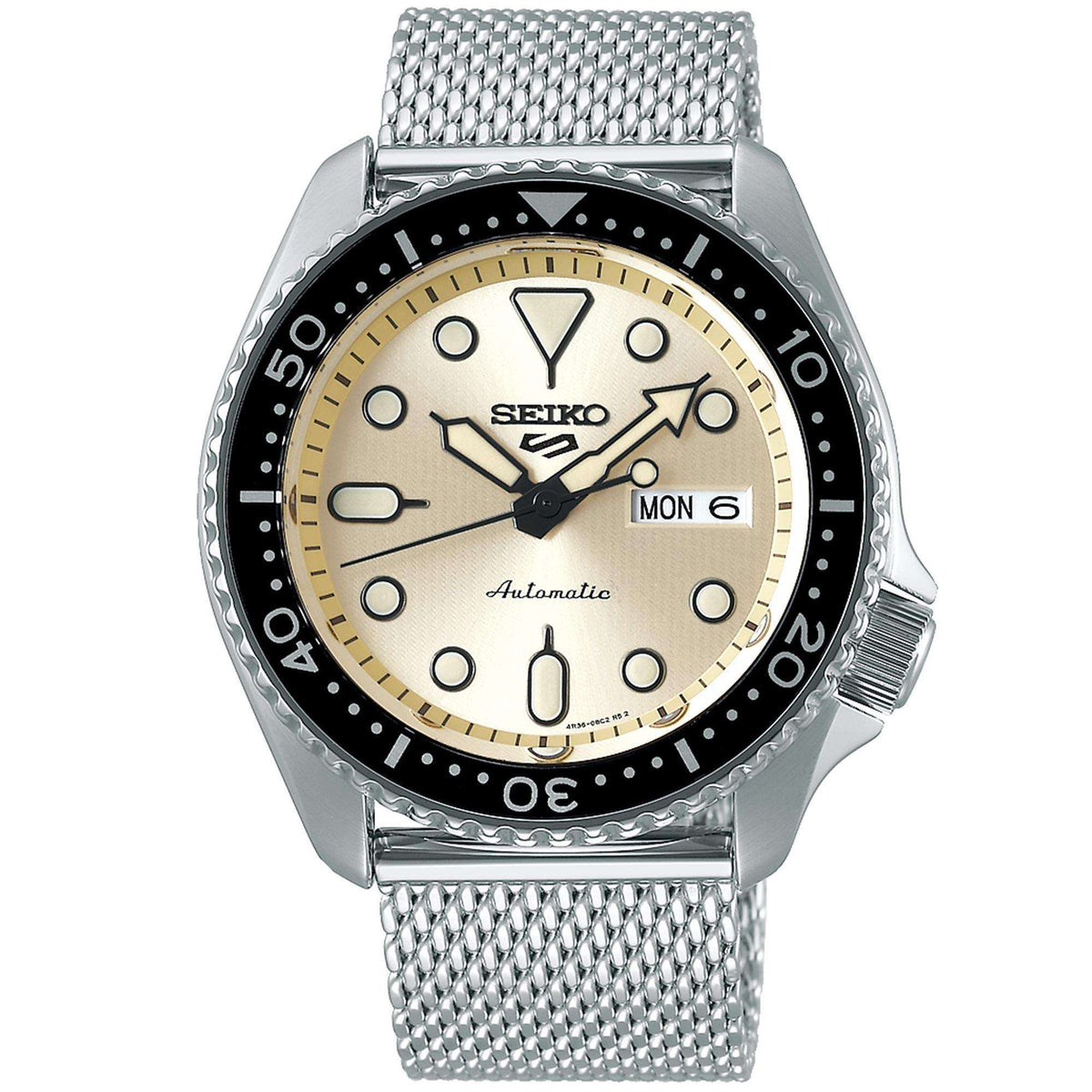 Men's automatic watch with cream dial, black bezel, and silver mesh bracelet, date MON 6