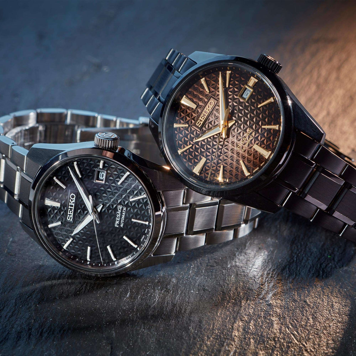 Silver stainless steel men's watch with black textured dial and metal bracelet
