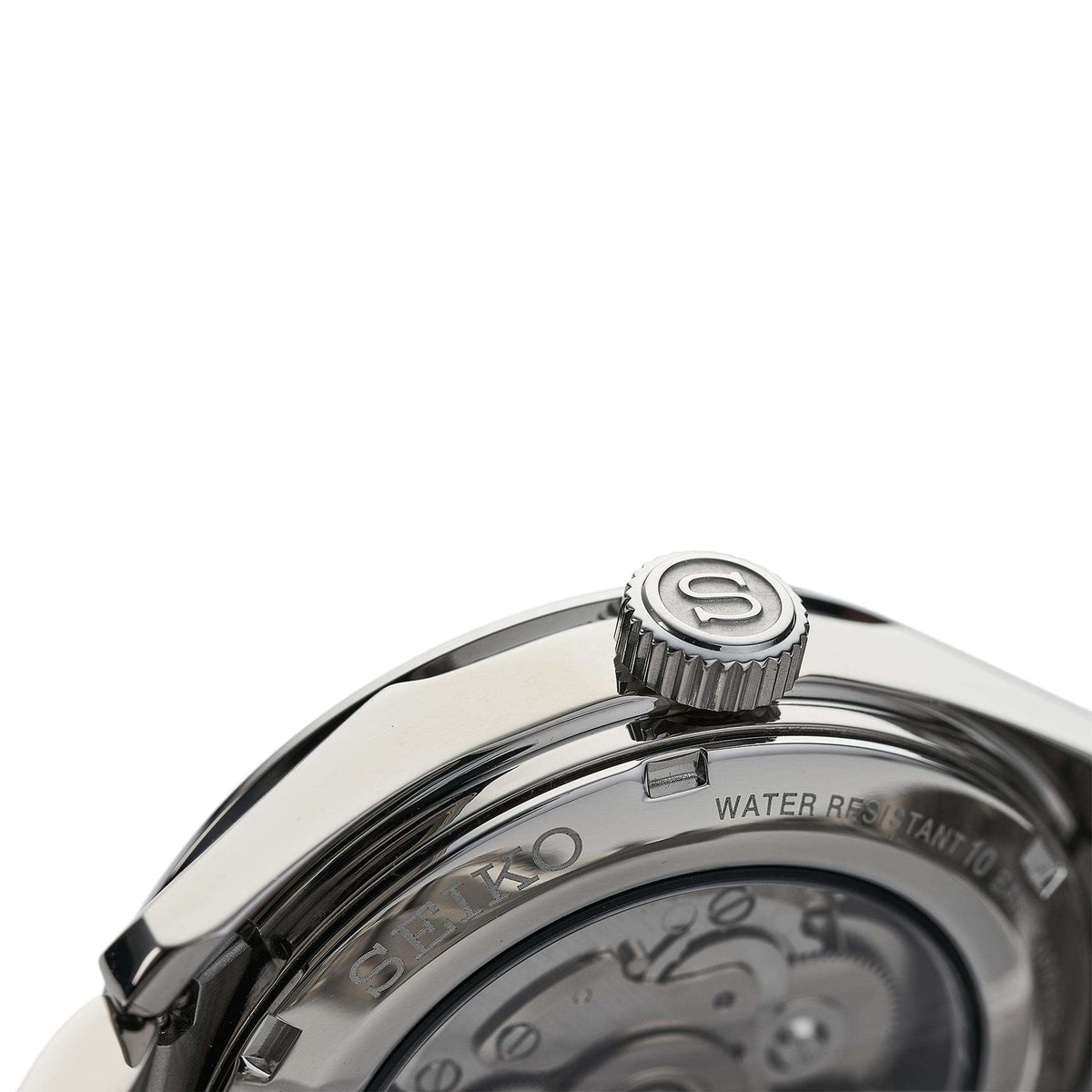 Stainless steel watch case close-up with screw-down crown and water resistance markings