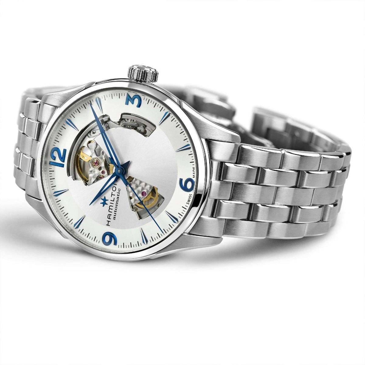 Men's automatic open-heart watch on wrist; silver steel bracelet, white dial, blue hands