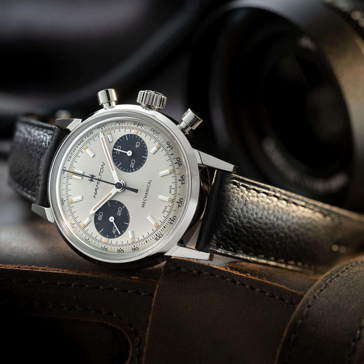 Hamilton chronograph watch side angle with white dial, black subdials, black leather strap