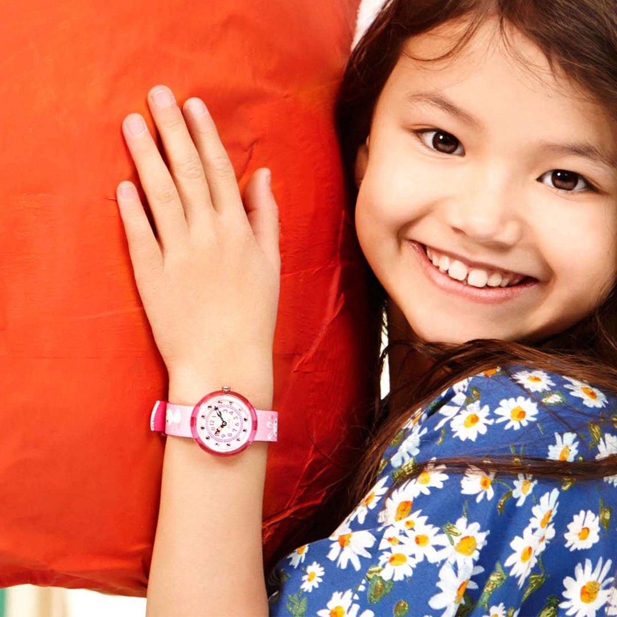 Pink kids wristwatch on child wrist with rabbit fabric strap and round pink dial