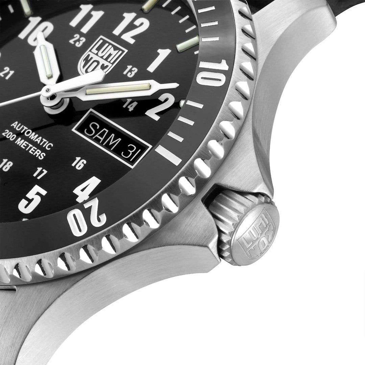 Close-up of sport watch bezel, crown, and black dial with luminous hour markers