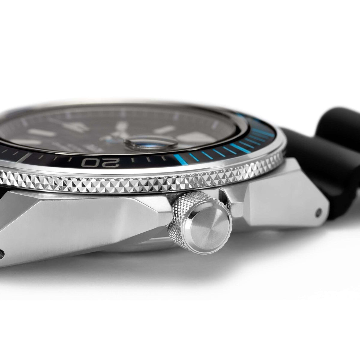 Seiko diver watch with textured bezel edge, crown detail, and black silicone strap