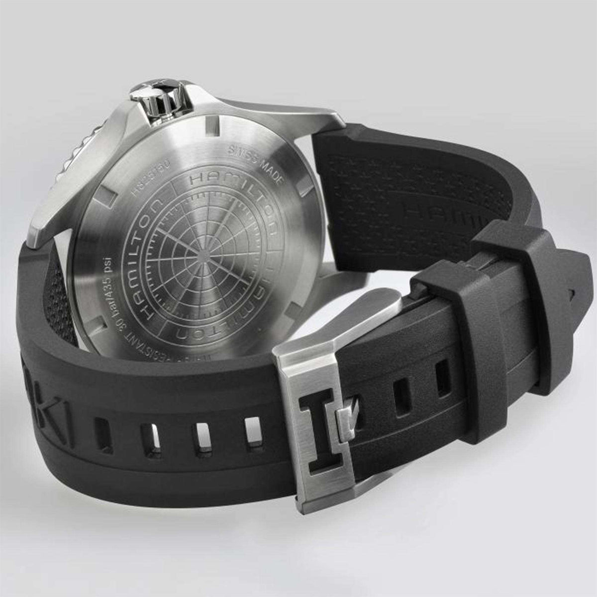 Men's black rubber scuba watch with silver case, black strap, and clasp buckle, side view