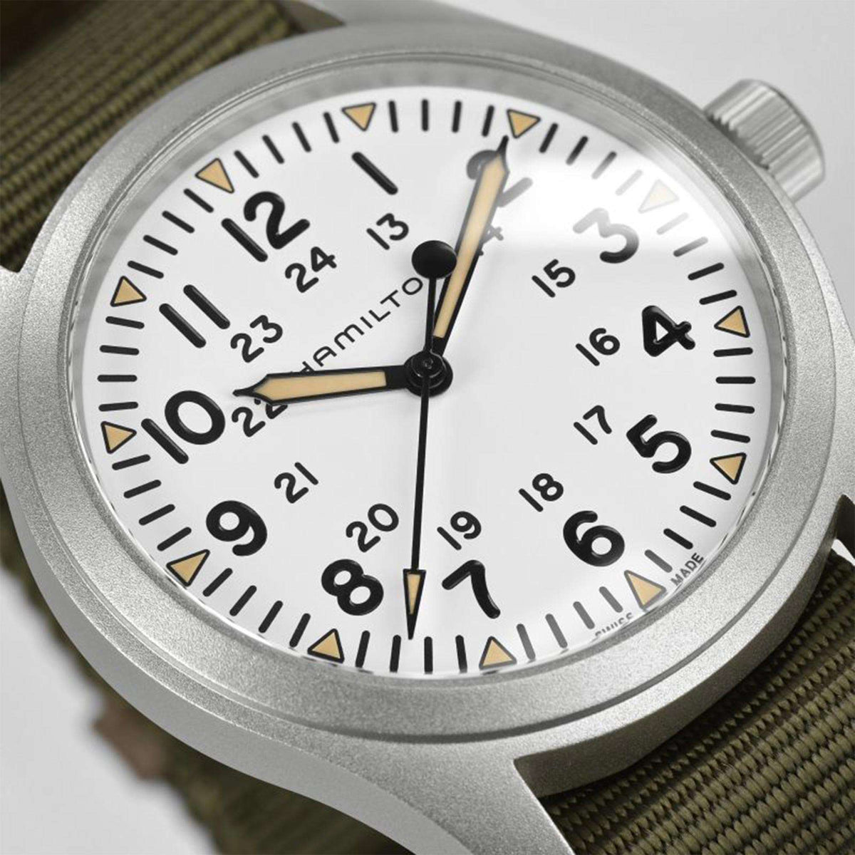 Hamilton Khaki Field H69529913 white dial with Arabic numerals and luminous hands close-up