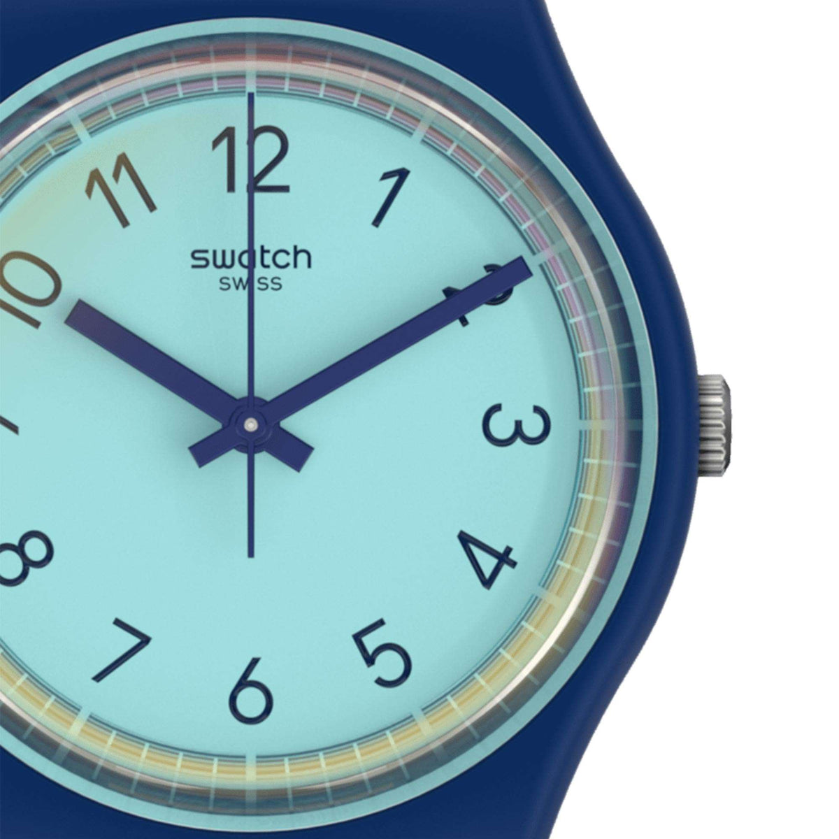 Close-up of mint-blue watch dial with dark blue hands and round bezel