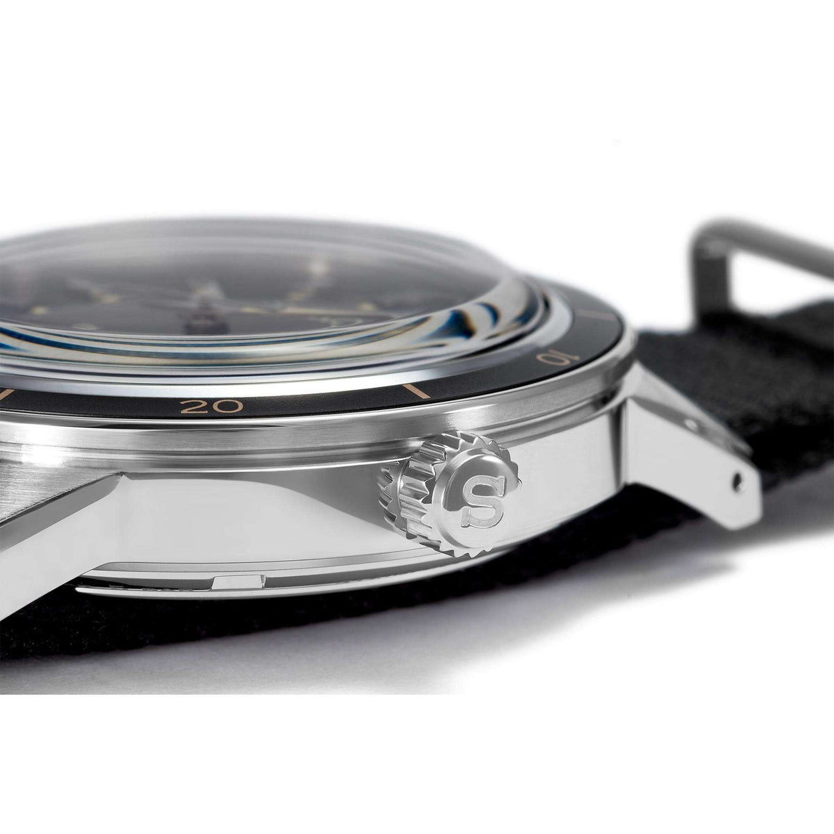 Stainless-steel watch case with crown detail and black fabric strap