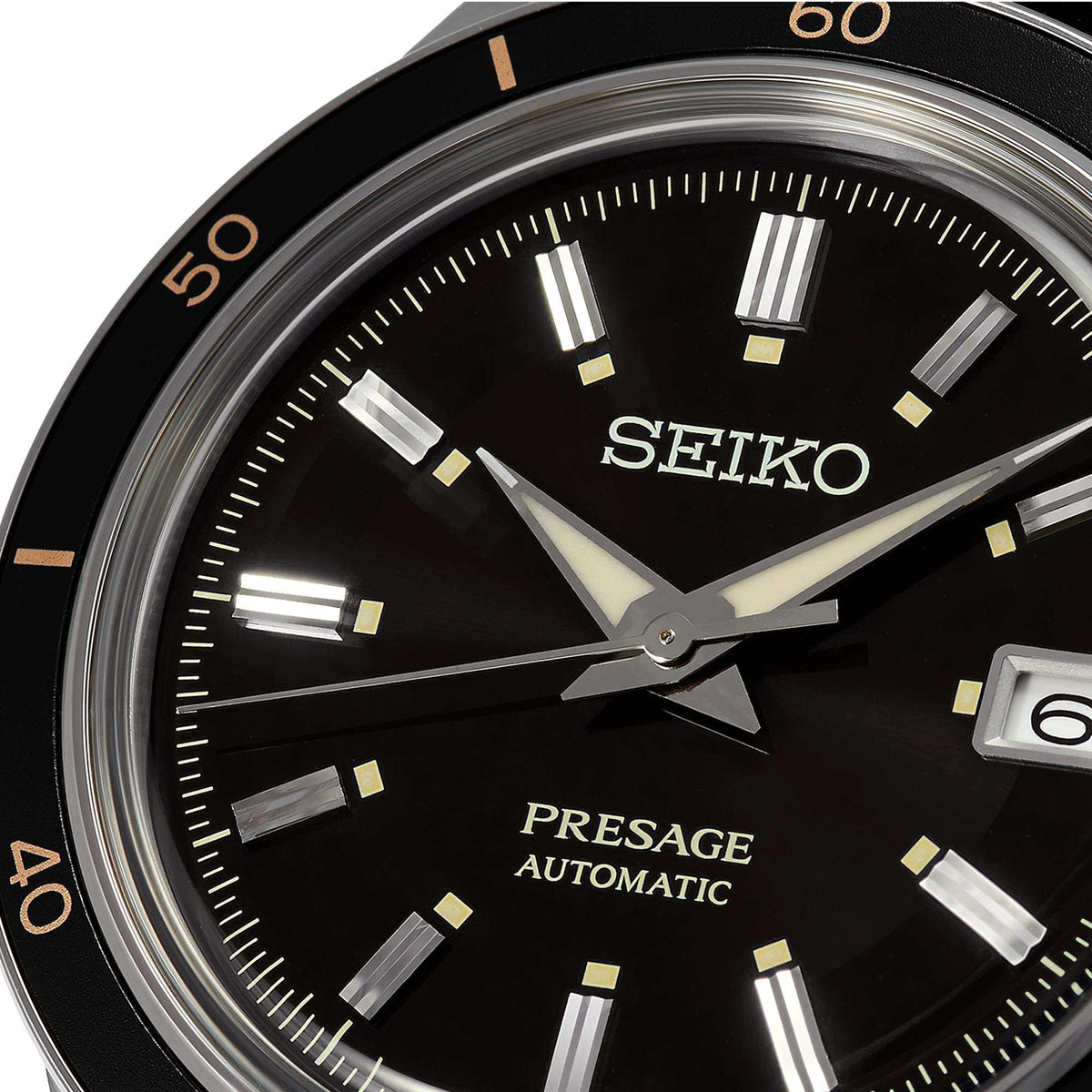 Close-up of black Seiko Presage automatic dial with gold hour markers and hands