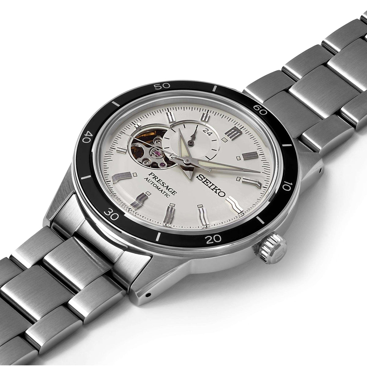 Men's stainless steel automatic watch angled view with silver dial, black bezel, bracelet