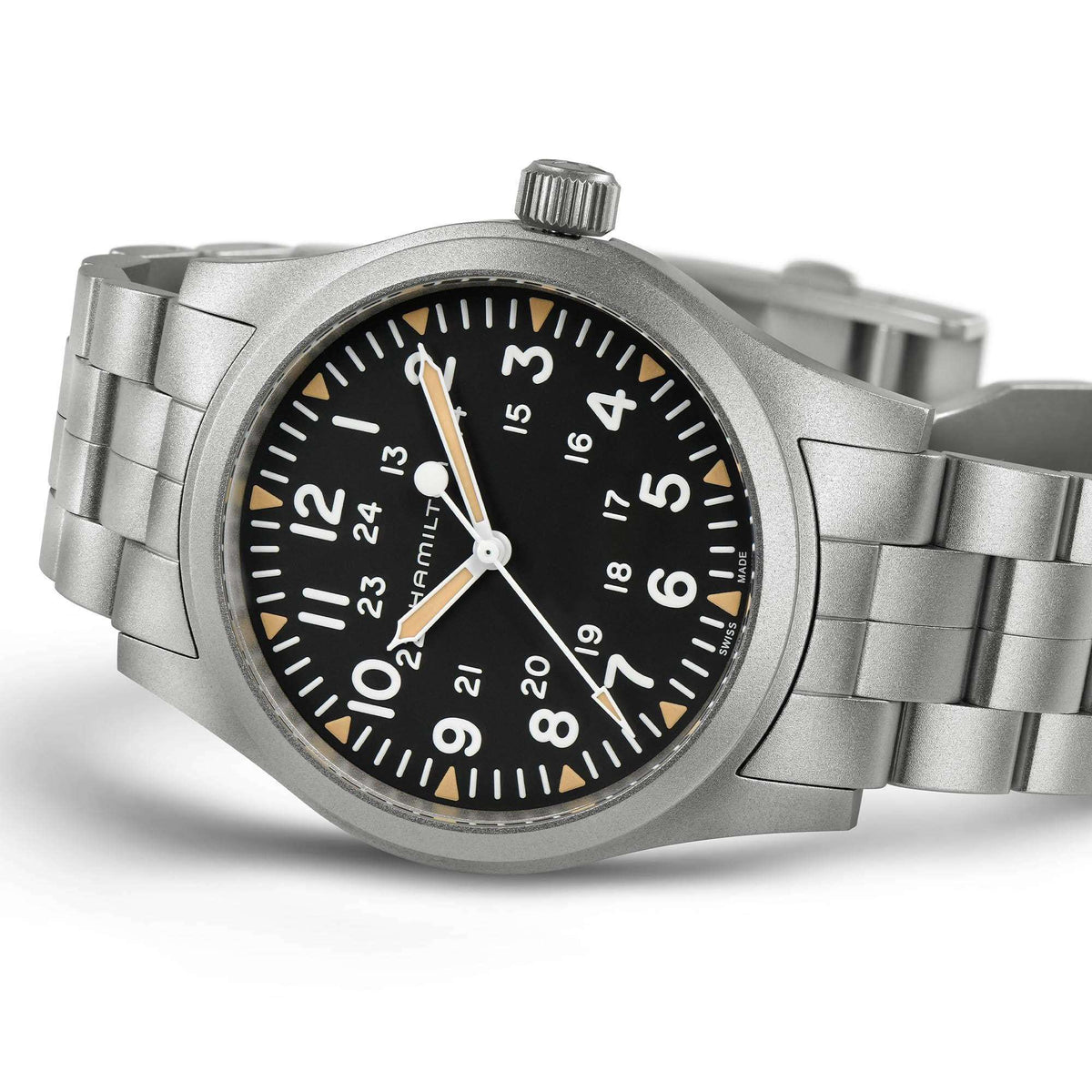 Men's mechanical wristwatch close-up: black dial with luminous markers, steel case and bracelet.