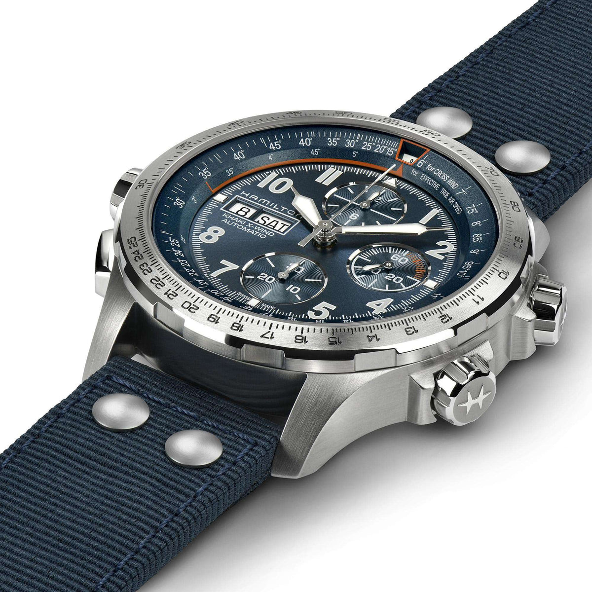 Men's automatic chronograph watch with blue dial, silver bezel, and blue fabric strap