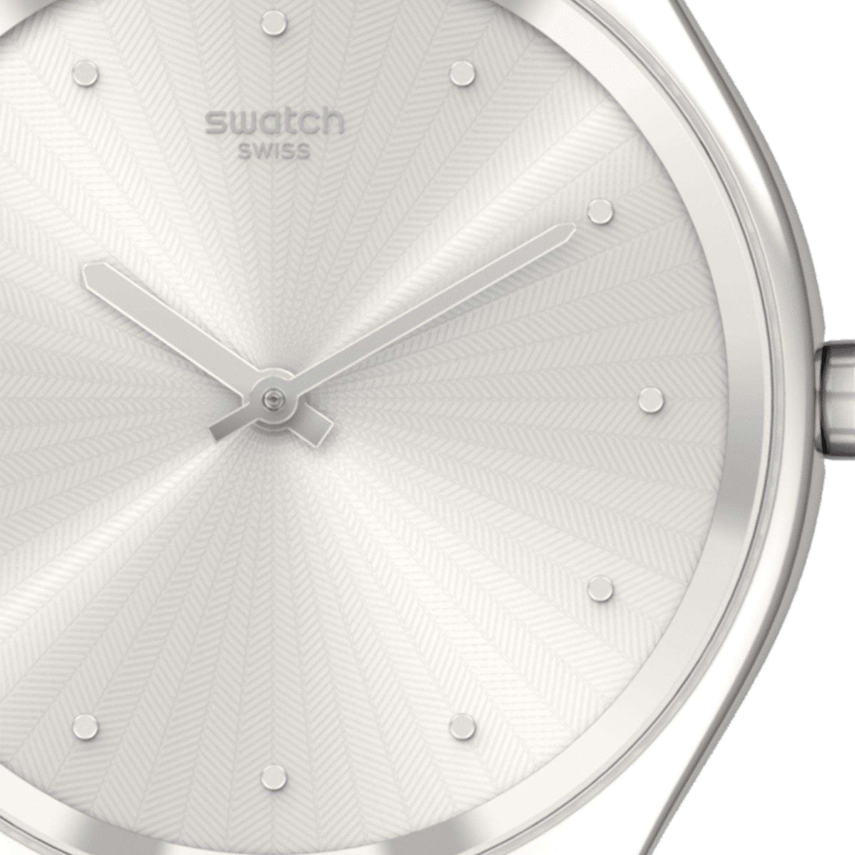 Ladies quartz watch close-up: silver bezel, white textured dial, dot hour markers, blue strap