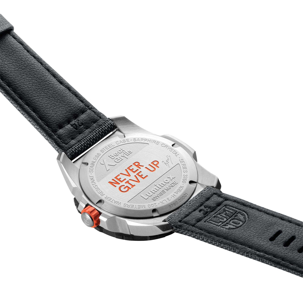 Men's watch case and black leather strap with orange button and engraved back